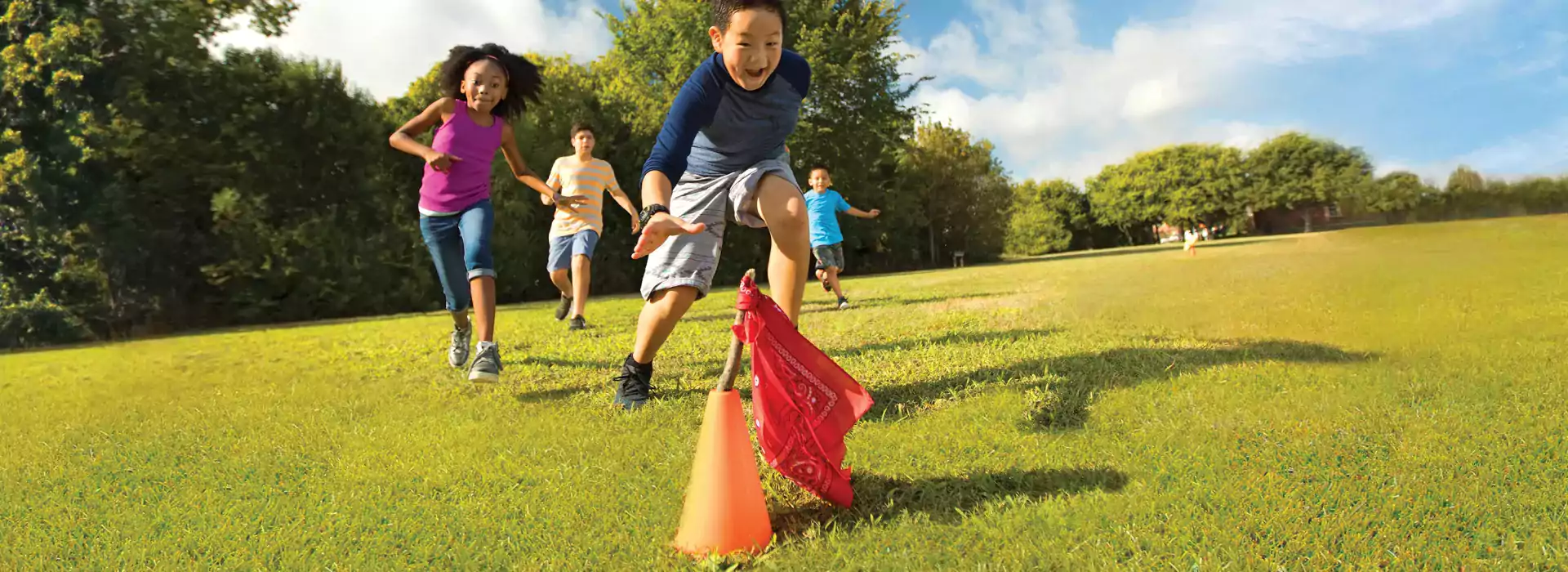 Camp kids playing capture the flag